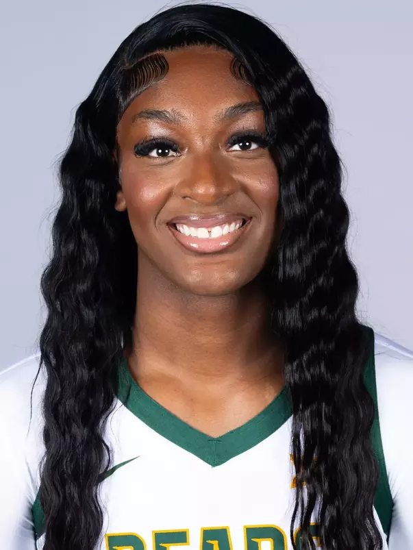 Kyla Abraham headshot in white uniform in front of white backdrop