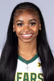 Tianna Thompson headshot in white uniform in front of white backdrop