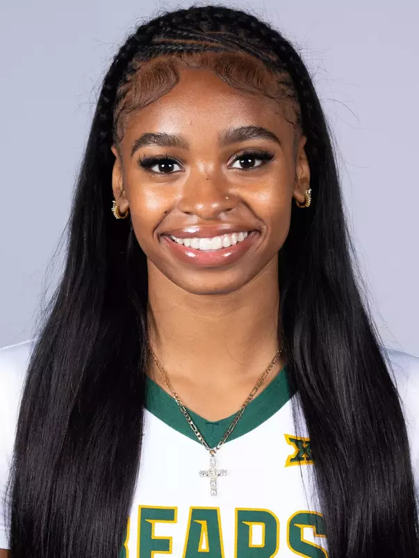 Tianna Thompson headshot in white uniform in front of white backdrop