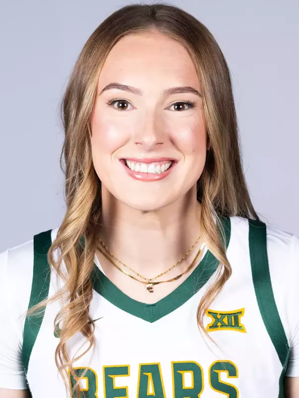 Ella Brow headshot in white uniform in front of white backdrop