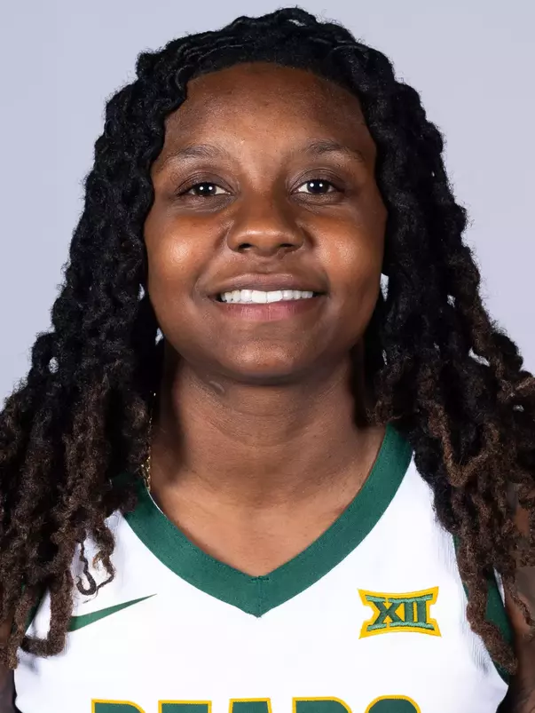 Trinity Turner headshot in white uniform in front of white backdrop