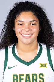 Kayla Nelms headshot in white uniform in front of white backdrop