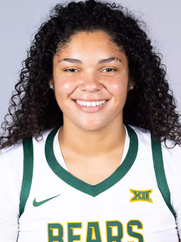 Kayla Nelms headshot in white uniform in front of white backdrop