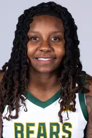 Trinity Turner headshot in white uniform in front of white backdrop
