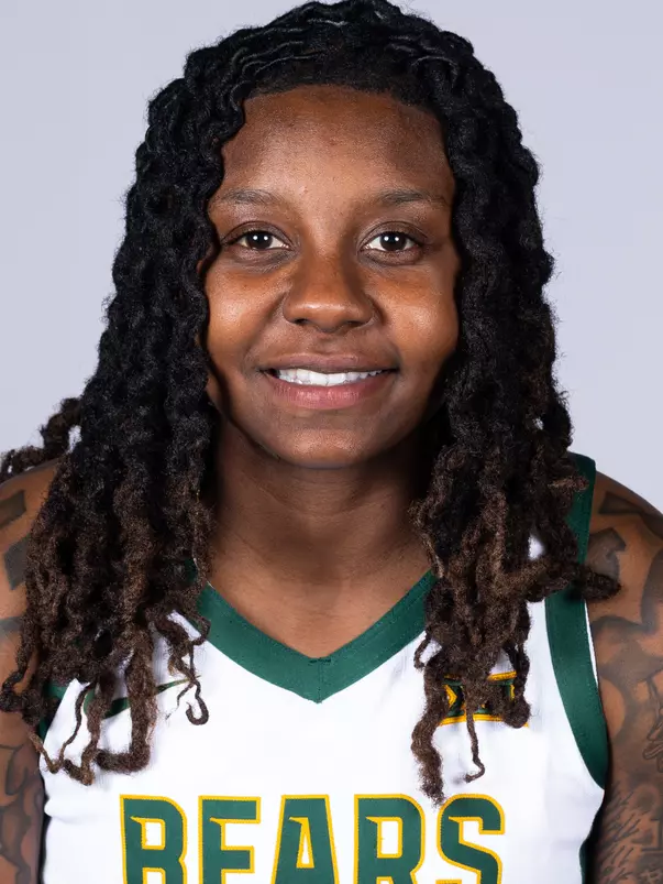 Trinity Turner headshot in white uniform in front of white backdrop