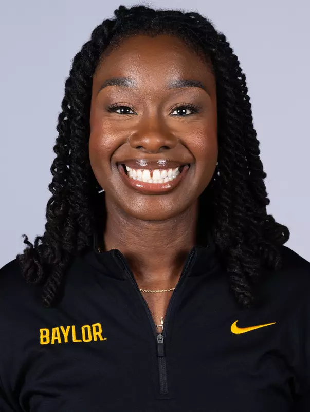 Juliana Smith 2026 Headshot in black pullover and white backdrop