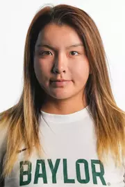 Gao Duanrui smiling in headshot in front of white backdrop