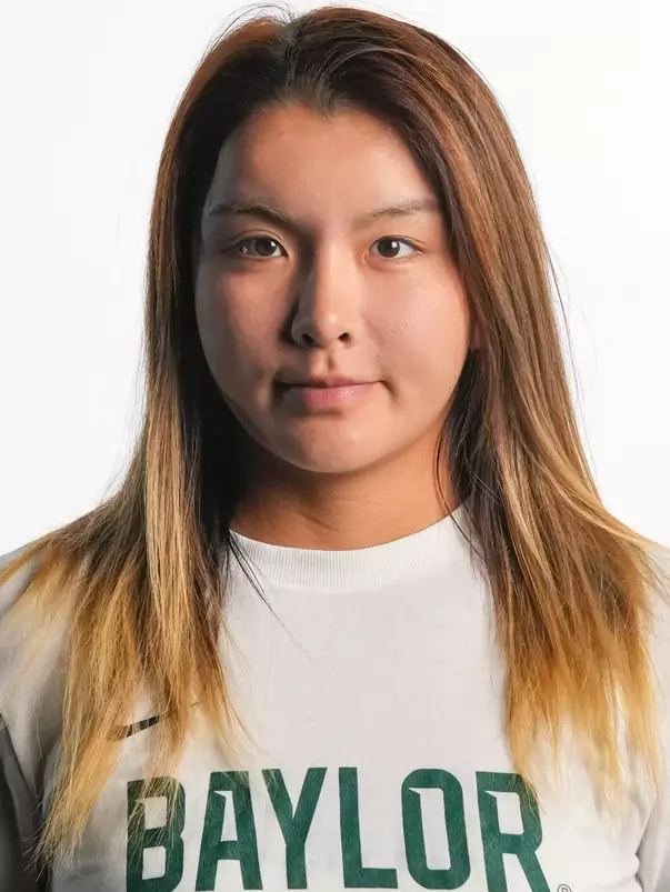 Gao Duanrui smiling in headshot in front of white backdrop