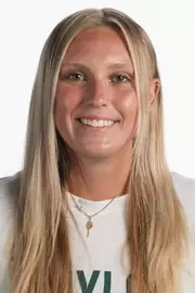 Kenna Erickson smiling in headshot in front of white backdrop