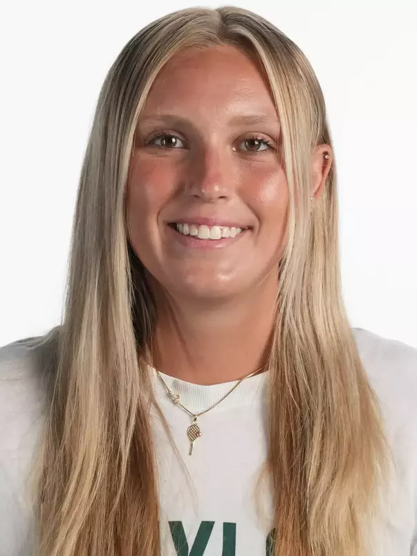 Kenna Erickson smiling in headshot in front of white backdrop