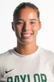 Luna Ivkovic smiling in headshot in front of white backdrop