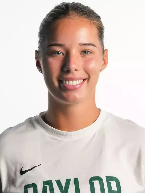 Luna Ivkovic smiling in headshot in front of white backdrop