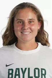 Zuzanna Kubacha smiling in headshot in front of white backdrop