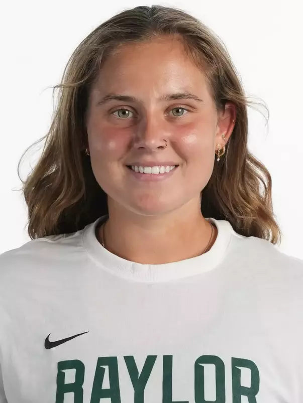 Zuzanna Kubacha smiling in headshot in front of white backdrop