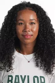 Ligaya Murray smiling in headshot in front of white backdrop