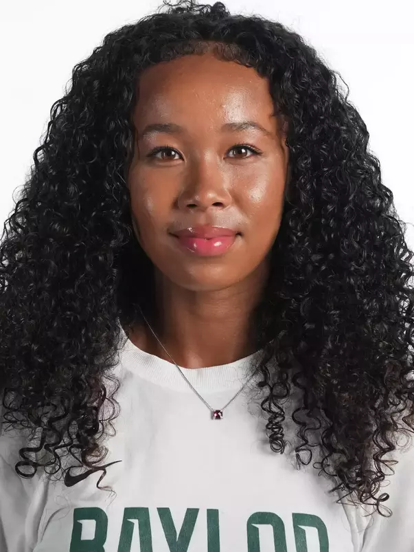Ligaya Murray smiling in headshot in front of white backdrop