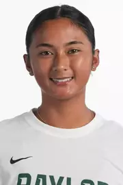 Gabby Villegas smiling in headshot in front of white backdrop