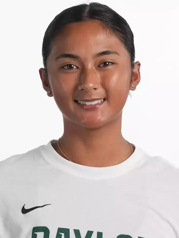 Gabby Villegas smiling in headshot in front of white backdrop