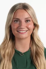 Lila Toll 2026-27 Headshot in front of a white backdrop