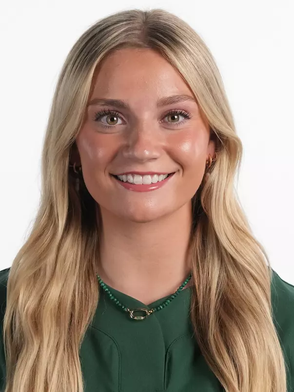 Lila Toll 2026-27 Headshot in front of a white backdrop