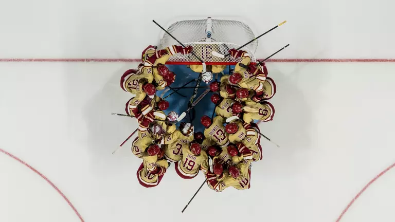 Over the goal team huddle