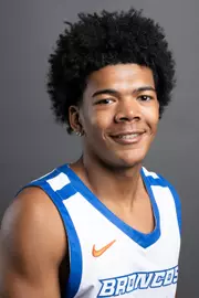 Men's basketball player Moses Hipps on a gray backdrop.