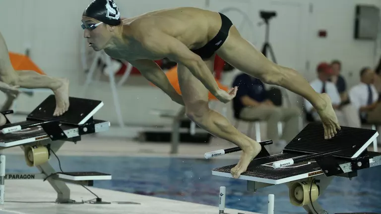 Men's Swimming & Diving Defeats UMass, 203-95