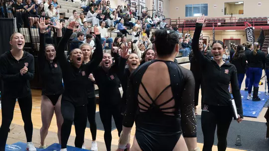 Gymnastics celebrates a vault by Sophia Dewar at the 2026 Senior Meet