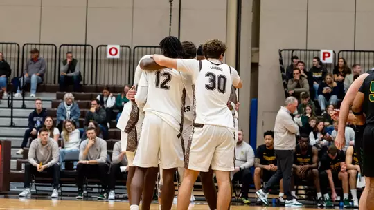 Men's Basketball Huddle Against Vermont on November 9, 2025