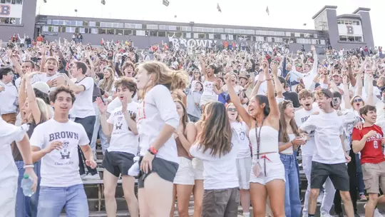 Brown fans cheer against Harvard in 2024
