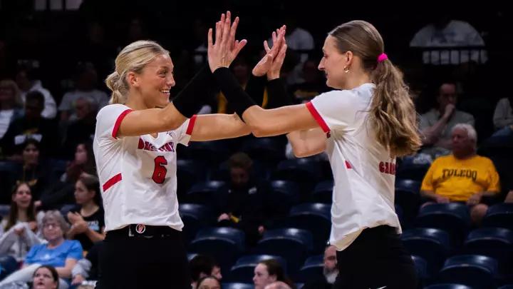 Merritt Sliwa and Tiffany Snook high five in Ball State's Oct. 3, 2026 setback at Toledo