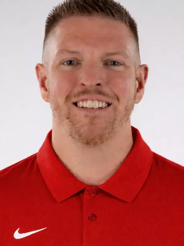 Jordan Surenkamp Headshot featuring Surenkamp in a red polo