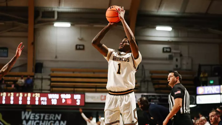 Trey Lewis in a white Western Michigan men's basketball jersey shooting a jump shot