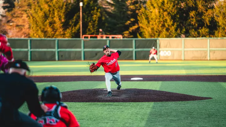 Alex Burden throws a pitch against IU on April 7th wearing a red jersey.