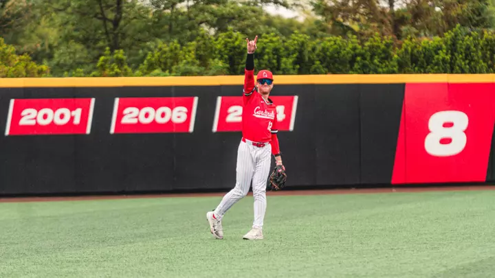 Brayden Huebner in a Ball State baseball uniform in the outfield