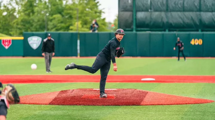 Brendan Garza in a black Ball State baseball uniform throwing a pitch on Wednesday at the MAC Tournament opener