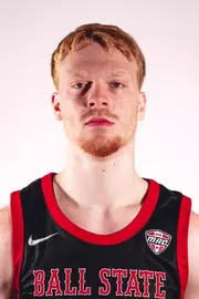 Aaron Fine headshot featuring Fine in a black Ball State basketball jersey