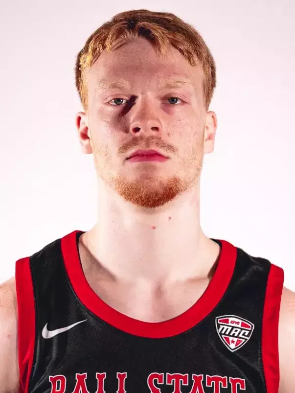 Aaron Fine headshot featuring Fine in a black Ball State basketball jersey