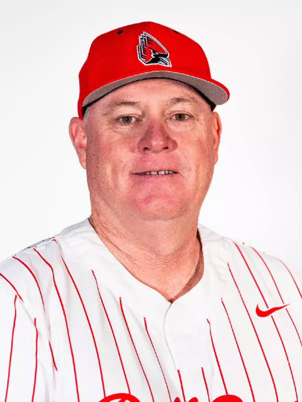 Bob Keller headshot featuring Keller in a red Ball State baseball hat and white pinstripes jersey