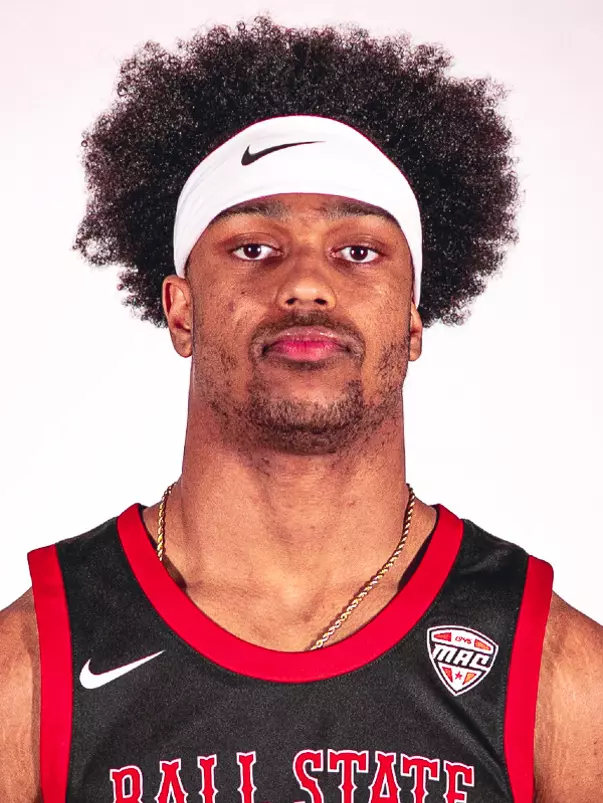 Headshot of Kai McGrew featuring him in a black Ball State basketball jersey