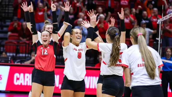 The Ball State women's volleyball team celebrates a set win in the Oct. 10 match versus Toledo.