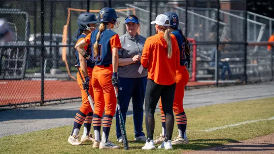 Coach Stackhouse, Coach Snyder, and their Players in Conference during a Timeout