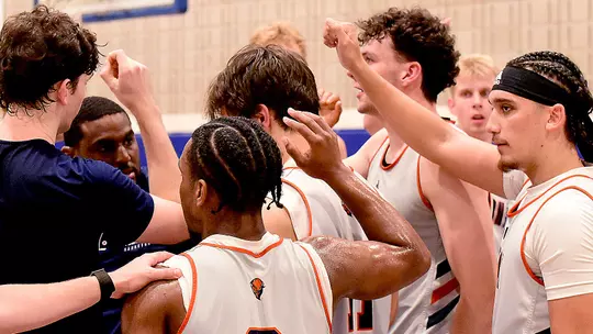 Men's Basketball Group Huddle