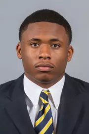 15FB Strickland_Carlos suit mug 800x640