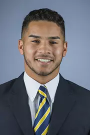 2016 Bug Rivera Coat And Tie Head Shot
