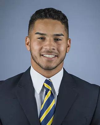 2016 Bug Rivera Coat And Tie Head Shot