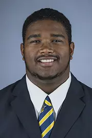2016 Marcus Manley Coat And Tie Head Shot