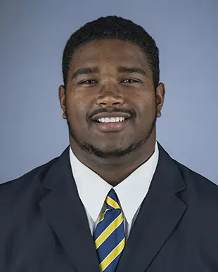 2016 Marcus Manley Coat And Tie Head Shot