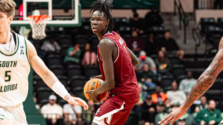 Chol Machot holds the basketball