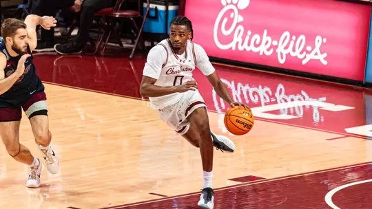 Jaxon Prunty dribbles the ball up the court